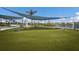 Enjoy lawn games like cornhole in this neighborhood on this manicured lawn near the community lake at 10470 Spring Tide Way, Parrish, FL 34219