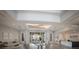 Elegant lobby area with comfortable seating, modern decor, and a welcoming reception desk at 10470 Spring Tide Way, Parrish, FL 34219