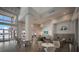 Inviting community lounge featuring modern seating, TV, and bright windows with serene views at 10470 Spring Tide Way, Parrish, FL 34219