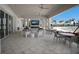 Inviting outdoor patio area with comfortable seating, a fireplace, and views of the pool at 10470 Spring Tide Way, Parrish, FL 34219