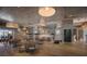 Elegant restaurant interior featuring stylish pendant lights, comfortable seating, and modern decor at 10470 Spring Tide Way, Parrish, FL 34219