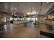 Spacious restaurant boasts a bar, wood floors, water views and cozy wicker light fixtures overhead at 10470 Spring Tide Way, Parrish, FL 34219