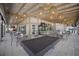 Outdoor restaurant seating features overhead lighting, a bar with TVs, and a full sized billiard table at 10470 Spring Tide Way, Parrish, FL 34219