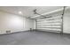 Spacious and clean garage with an epoxy floor and insulated garage door at 1210 Gulf Blvd, Englewood, FL 34223