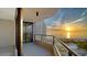 Enjoy stunning ocean views from this balcony with glass railings and tiled floor at 1211 Gulf Of Mexico Dr # 701, Longboat Key, FL 34228
