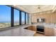 This kitchen features lots of windows, wooden cabinets, tile countertops and modern appliances at 1211 Gulf Of Mexico Dr # 701, Longboat Key, FL 34228