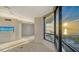 Spacious living room with ocean view and access to a balcony through large windows at 1211 Gulf Of Mexico Dr # 701, Longboat Key, FL 34228