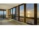 Bright living room featuring floor-to-ceiling windows with stunning water views at 1211 Gulf Of Mexico Dr # 701, Longboat Key, FL 34228