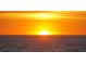 Bright view of the sun rising over the ocean horizon with blue skies at 1211 Gulf Of Mexico Dr # 701, Longboat Key, FL 34228