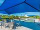 Bocce ball court under a shaded structure with seating for spectators at 12325 Marsh Pointe Rd, Sarasota, FL 34238