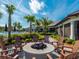 Outdoor fire pit with Adirondack chairs, perfect for relaxing near the pool and clubhouse at 12325 Marsh Pointe Rd, Sarasota, FL 34238