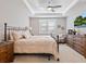 Comfortable main bedroom featuring a ceiling fan, neutral decor, and ample natural light at 12325 Marsh Pointe Rd, Sarasota, FL 34238