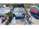 Aerial shot of a home with mature trees near a street; red truck in driveway at 132 Harrison Dr, Sarasota, FL 34236