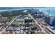 An aerial shot highlighting the property's proximity to the beach and nearby high-rise buildings at 132 Harrison Dr, Sarasota, FL 34236