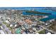 The property is surrounded by lush greenery and other charming residences at 132 Harrison Dr, Sarasota, FL 34236
