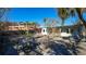 Spacious backyard featuring a patio area, perfect for outdoor gatherings and relaxation under the trees at 132 Harrison Dr, Sarasota, FL 34236