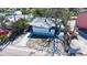 The property is surrounded by lush greenery and a well-maintained yard at 132 Harrison Dr, Sarasota, FL 34236