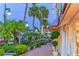 Charming street view with lush landscaping, decorative lights, and storefronts in a pedestrian area at 132 Harrison Dr, Sarasota, FL 34236