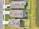 Aerial view of three houses, showcasing their roof and backyard layouts from directly above at 13528 Sunset Sapphire Ct, Parrish, FL 34219