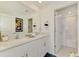 Contemporary bathroom with double sinks, quartz countertops, and modern fixtures at 13528 Sunset Sapphire Ct, Parrish, FL 34219