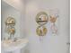 Stylish half-bathroom with modern fixtures, decorative shelving, and vanity sink at 13528 Sunset Sapphire Ct, Parrish, FL 34219