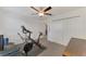 Bright bedroom featuring an exercise bike and a large closet at 13528 Sunset Sapphire Ct, Parrish, FL 34219