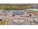 Aerial view of a construction site with playground and equipment, showcasing its progress and amenities at 13528 Sunset Sapphire Ct, Parrish, FL 34219