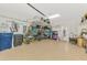 Well-organized garage with storage solutions, epoxy flooring, and ample space at 13528 Sunset Sapphire Ct, Parrish, FL 34219