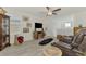 A comfortable living room with recliners, unique decor, and a ceiling fan at 13528 Sunset Sapphire Ct, Parrish, FL 34219