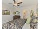 Bedroom showcases a dresser, ensuite bath, and stylish decor creating a comfortable and inviting retreat at 13528 Sunset Sapphire Ct, Parrish, FL 34219