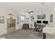 Bright home office features a ceiling fan, a workstation, and stylish decor at 13528 Sunset Sapphire Ct, Parrish, FL 34219