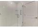 A glass-enclosed shower boasts white subway tile and modern fixtures at 13528 Sunset Sapphire Ct, Parrish, FL 34219