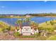 Community entrance sign with a serene lake backdrop, welcoming residents and visitors to the neighborhood at 13528 Sunset Sapphire Ct, Parrish, FL 34219