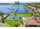 An aerial view of the marina, pool, and tennis court overlooking a stunning view of the waterfront at 1522 3Rd Street E Cir, Palmetto, FL 34221