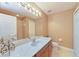Bathroom features a large mirror, ample lighting, and a stylish vanity area at 1522 3Rd Street E Cir, Palmetto, FL 34221