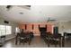 Interior of the common room including tables, chairs, kitchenette, and a TV for gatherings at 1522 3Rd Street E Cir, Palmetto, FL 34221