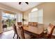 The dining room has a table and sliding glass door leading to the outdoor patio at 1522 3Rd Street E Cir, Palmetto, FL 34221