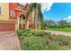 Beautiful townhome featuring a well manicured lawn, colorful paint, and a brick driveway at 1522 3Rd Street E Cir, Palmetto, FL 34221