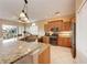 The kitchen features granite countertops, stainless steel appliances, and natural light at 1522 3Rd Street E Cir, Palmetto, FL 34221