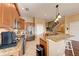 The kitchen features granite countertops, stainless steel appliances, and a breakfast bar with seating at 1522 3Rd Street E Cir, Palmetto, FL 34221