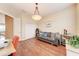 Bright living room with a gray sofa, wood floors, and lots of natural light at 1522 3Rd Street E Cir, Palmetto, FL 34221