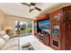 Living room with media center, patio access, and views of the water at 1522 3Rd Street E Cir, Palmetto, FL 34221