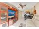 Living room with built-in shelving, a desk, and large media center at 1522 3Rd Street E Cir, Palmetto, FL 34221