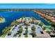 Stunning aerial view of the community clubhouse with pool and lake at 167 Maraviya Blvd, Nokomis, FL 34275