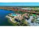 Aerial view of the community clubhouse, pool, and lake at 167 Maraviya Blvd, Nokomis, FL 34275
