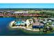Panoramic aerial view of the clubhouse, community pool, and surrounding lake at 167 Maraviya Blvd, Nokomis, FL 34275