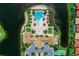 Aerial view of the pool, amenities, and waterfront of the community at 167 Maraviya Blvd, Nokomis, FL 34275