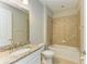 Cozy bathroom with granite countertop and tiled shower and tub at 167 Maraviya Blvd, Nokomis, FL 34275