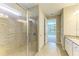 Bathroom featuring a glass shower, and tile floors leading to the bedroom at 167 Maraviya Blvd, Nokomis, FL 34275