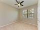 A bright bedroom with carpet, ceiling fan, and a large window at 167 Maraviya Blvd, Nokomis, FL 34275